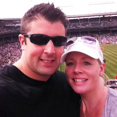 Carm and his wife at a Bear's game